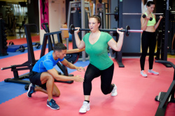 Plus size woman's first training with personal trainer